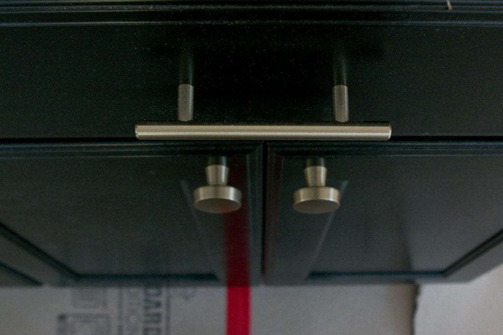 champagne cabinet knobs and pulls on black cabinets