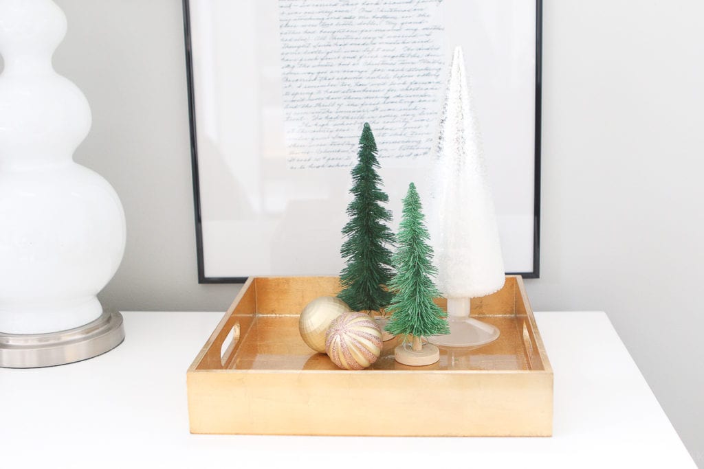 Gold tray with bottle brush trees