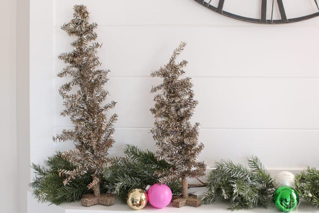 Gold trees on the fireplace mantle