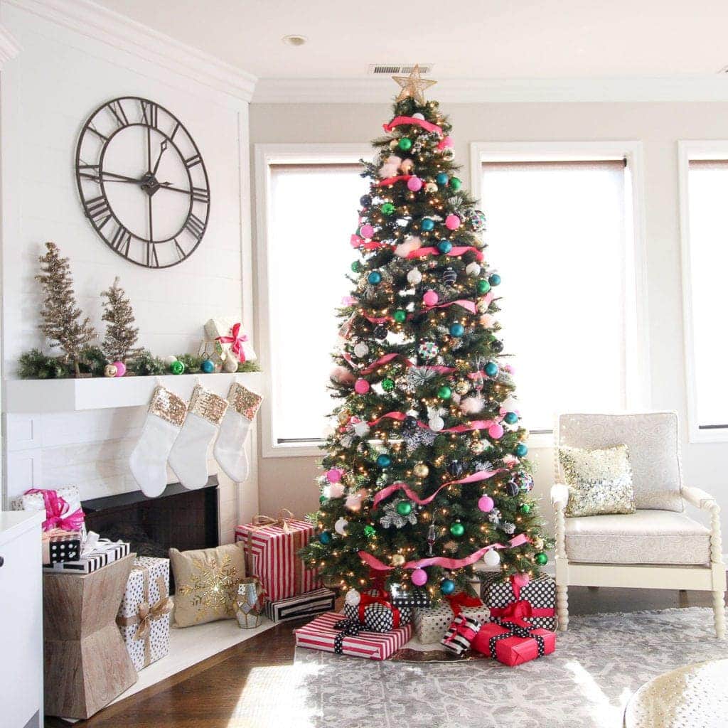 Colorful Christmas tree with pink ribbon and gold accents