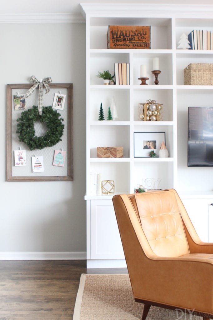 Christmas card display next to holiday built-in shelves