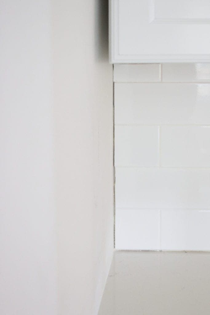 caulk tile next to wall