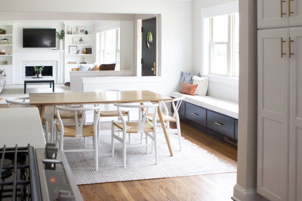 dining room window seat with black cabinets