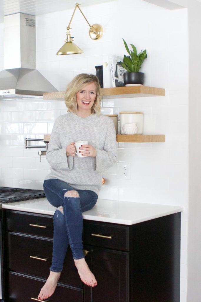 Bridget enjoying a cup of coffee in her home