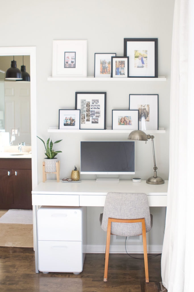 A white file cabinet under a slim desk area