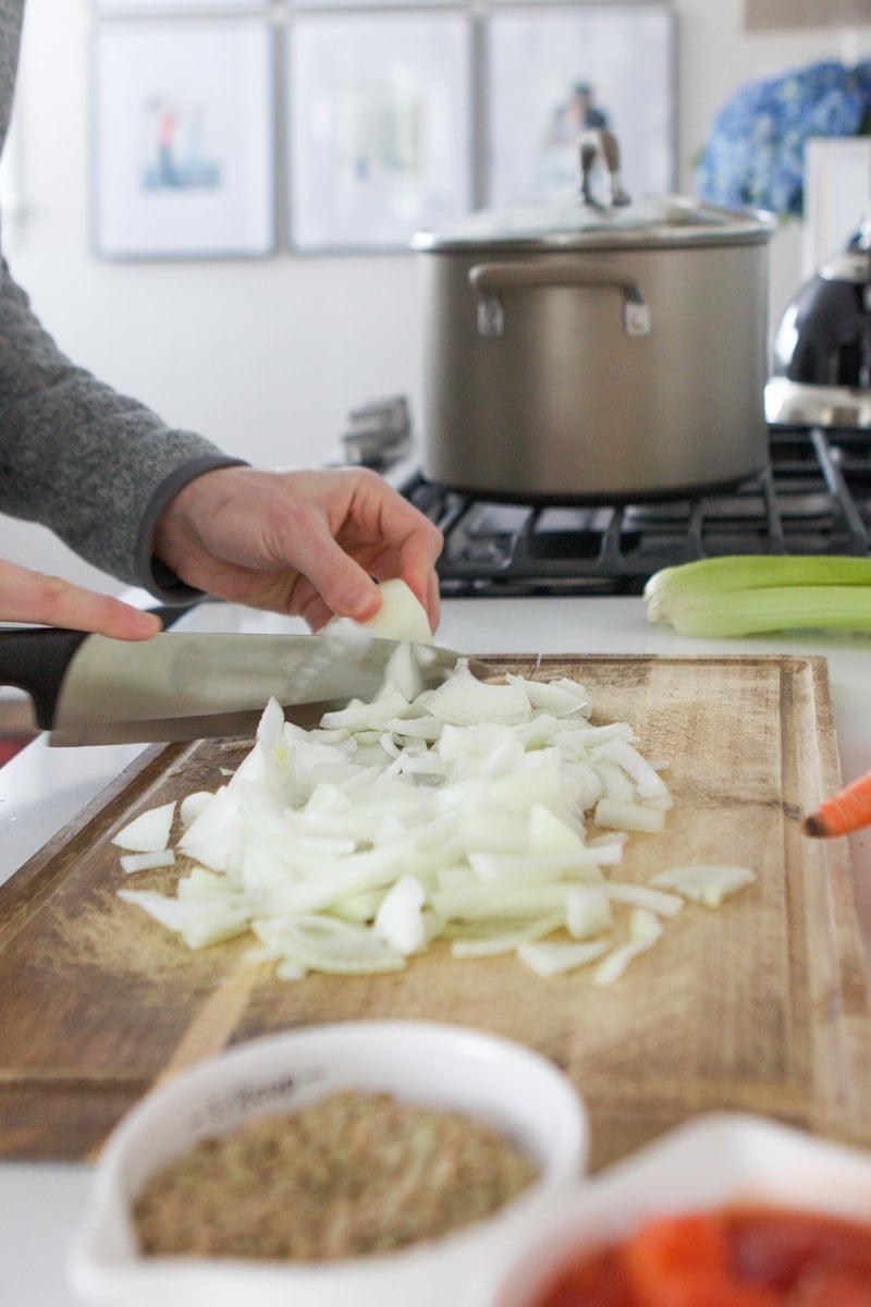 chopping onions for lentil soup