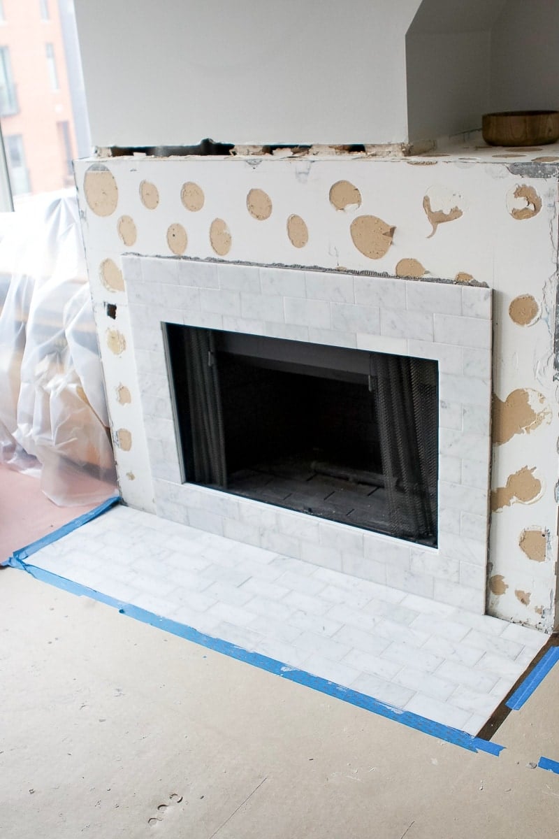 Fireplace makeover with marble subway tile
