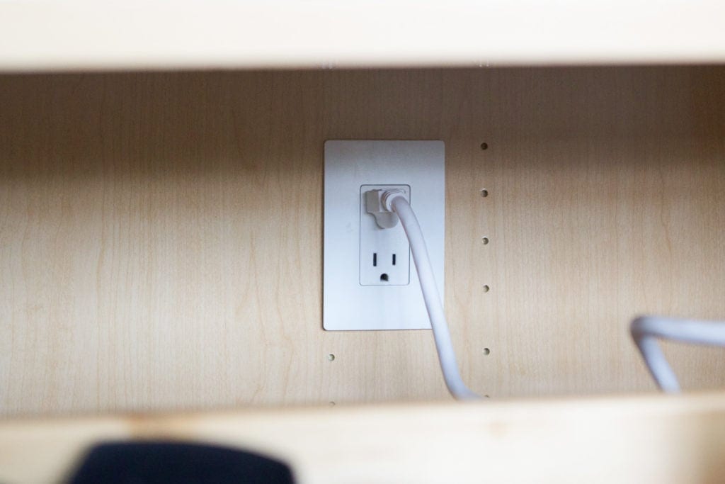 electrical outlet inside of a cabinet