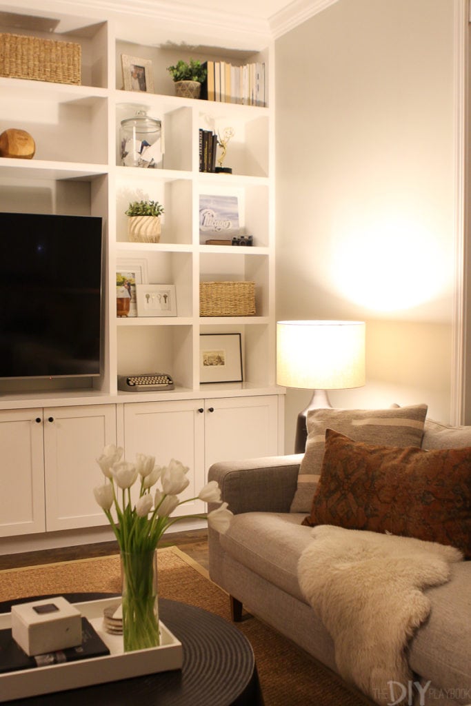 Turn a table lamp on at night for flattering light