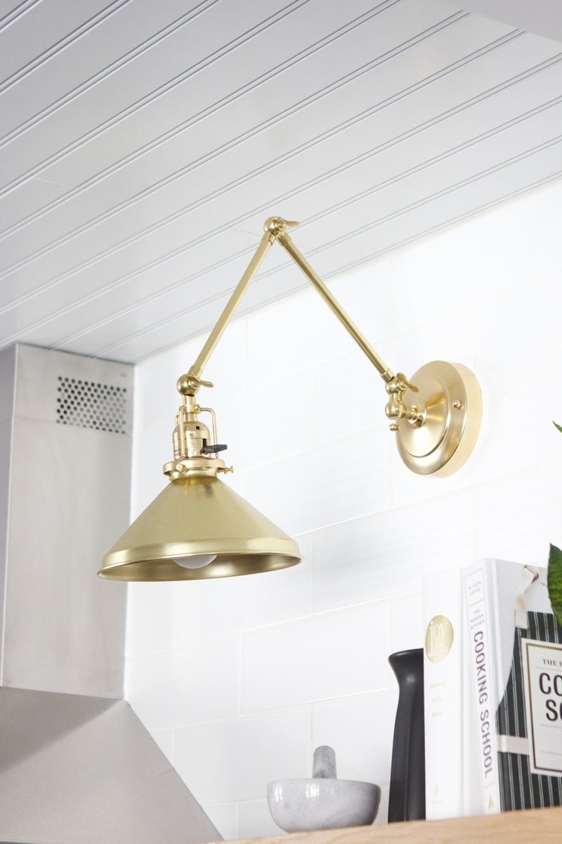 sconce over open shelving