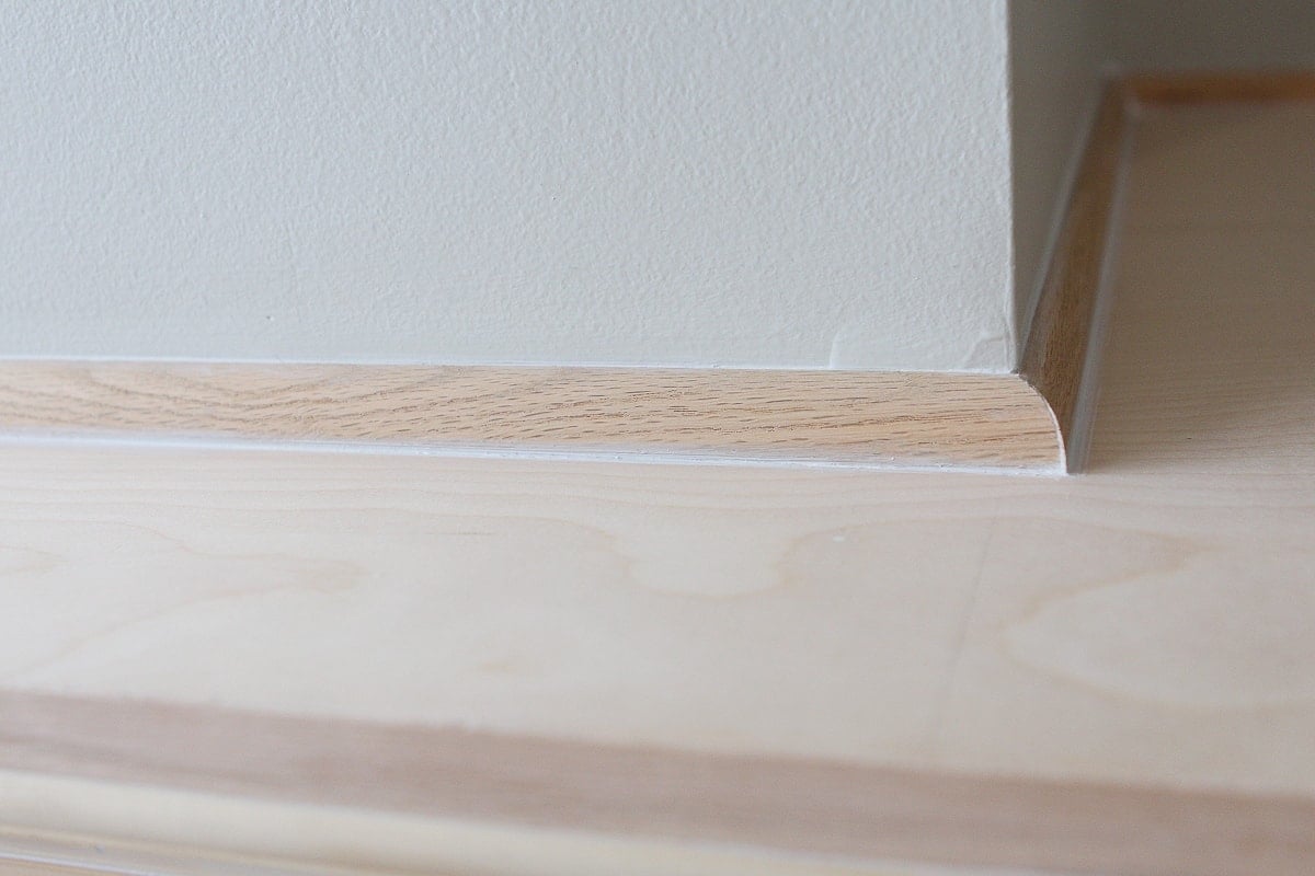 Shoe molding to hide gaps on fireplace woodworking
