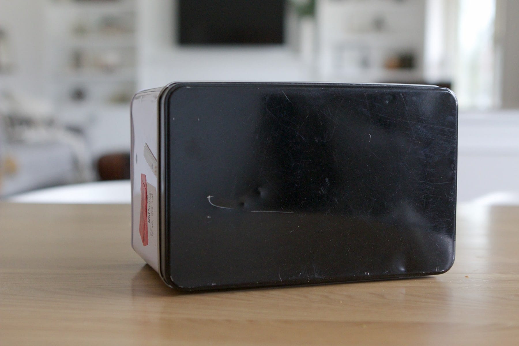 Black tin biscuit box