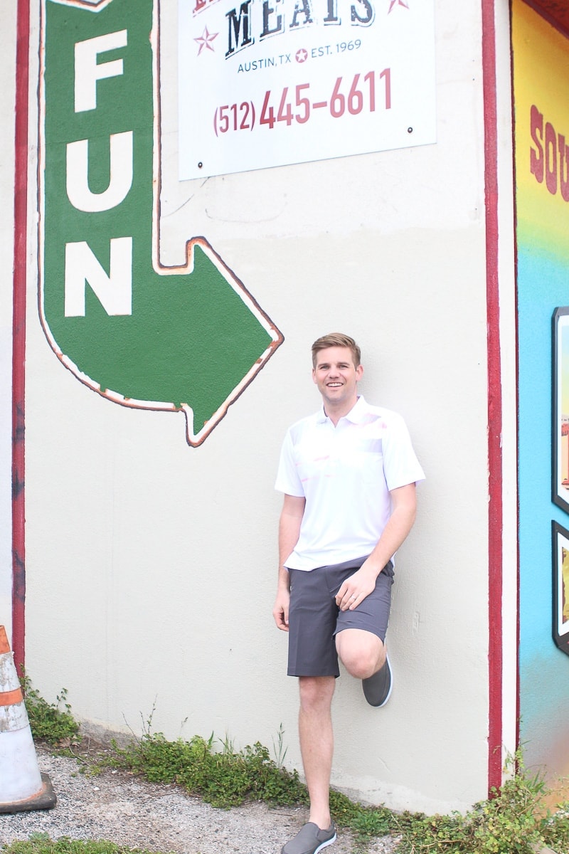 Finn wearing a white polo in Austin