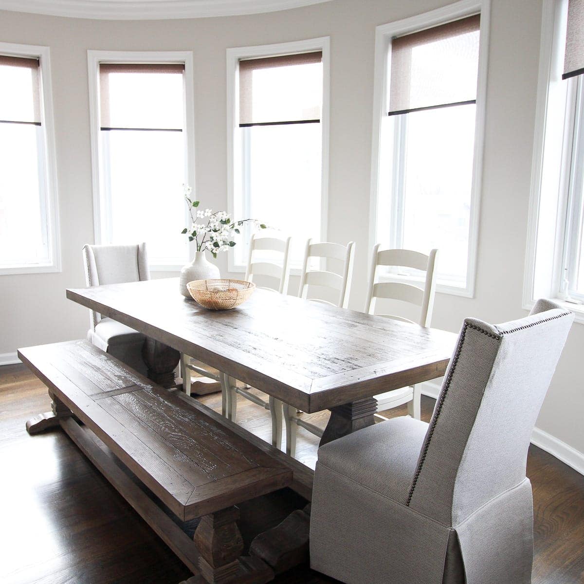 Farmhouse dining room in a feminine home tour