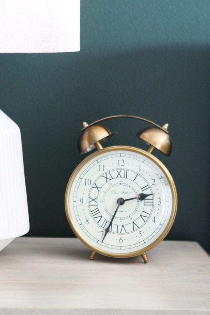 Gold clock on a nightstand