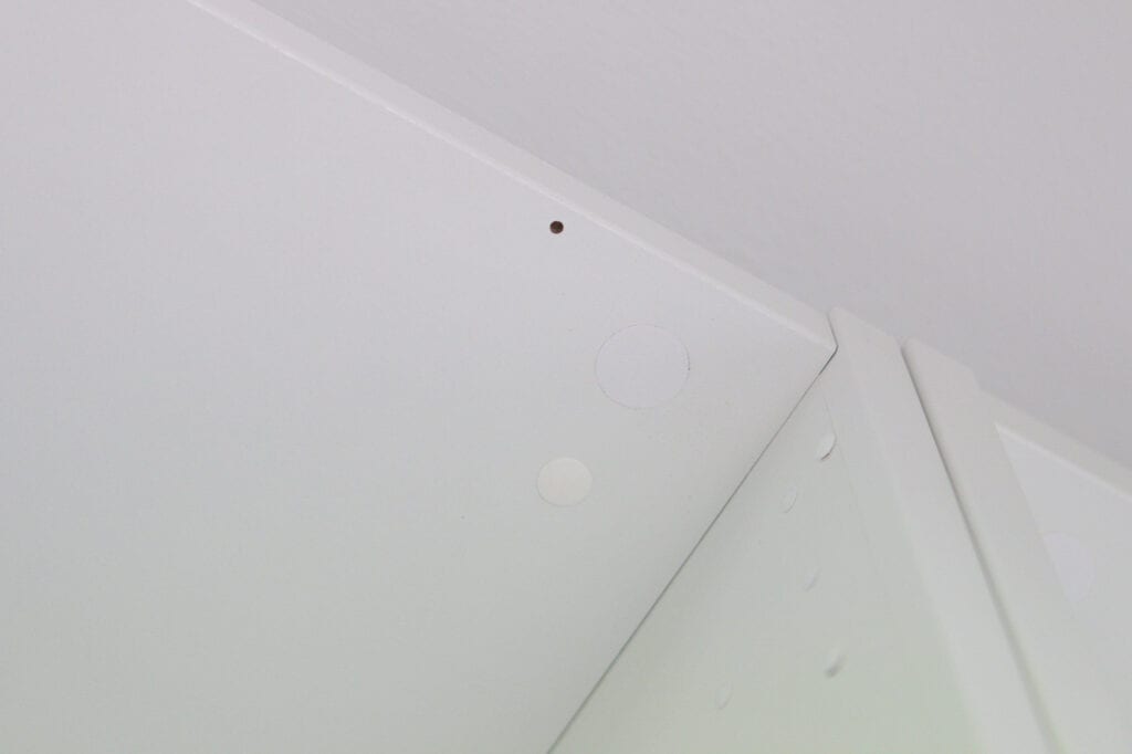 Using a sticker to cover screw hole on ikea pax wardrobe