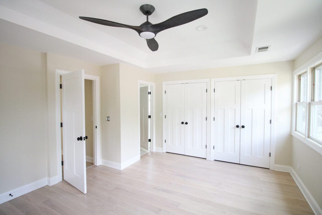 Master bedroom with new doors and black door knobs