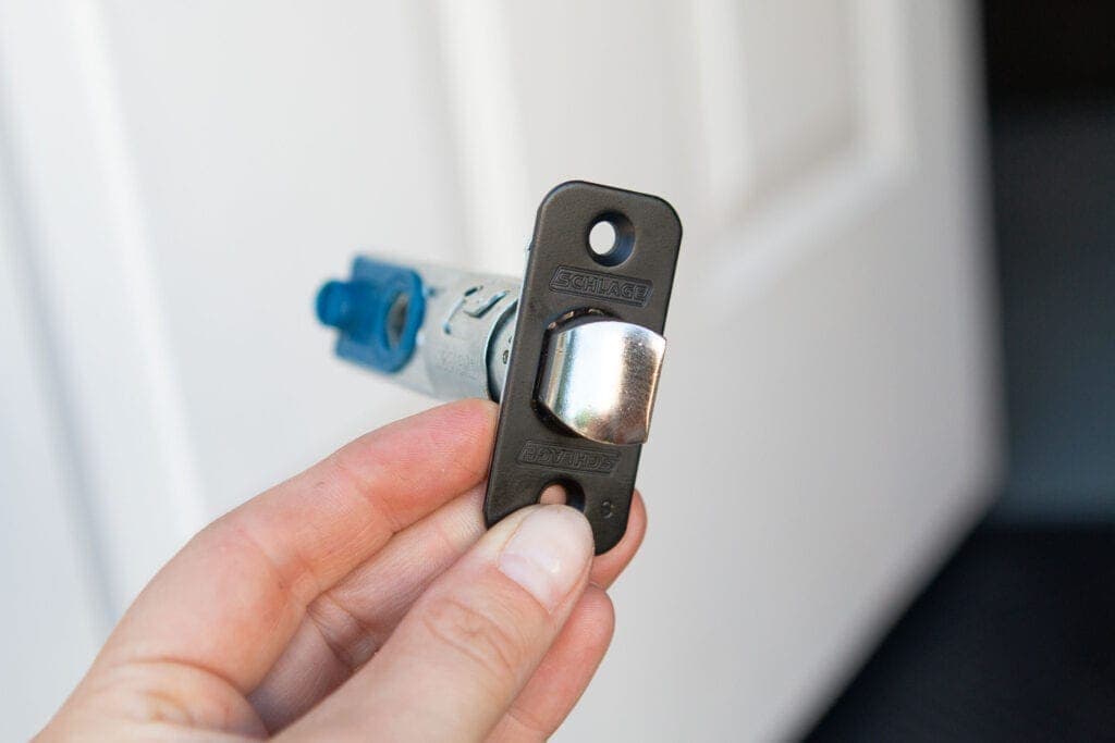 Adding a new latch to the door hardware