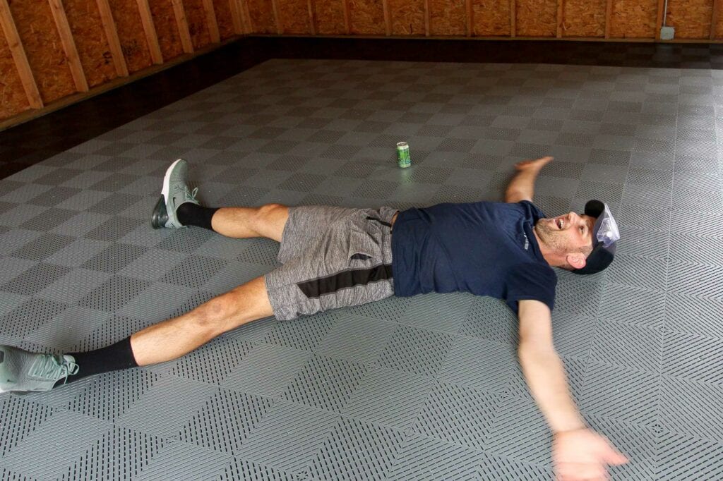 Doing snow angels on the garage floor tiles