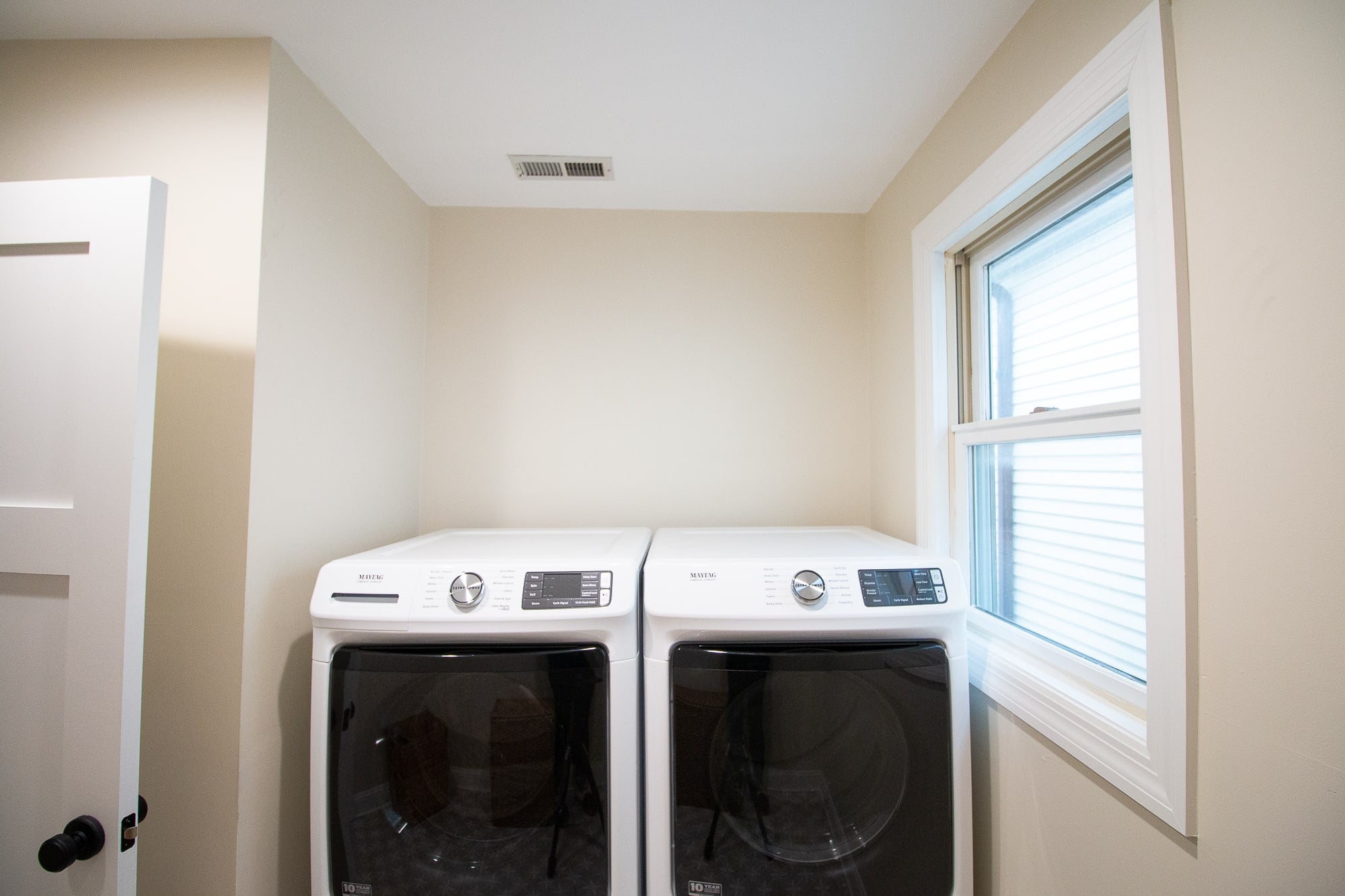 Over the washer and dryer