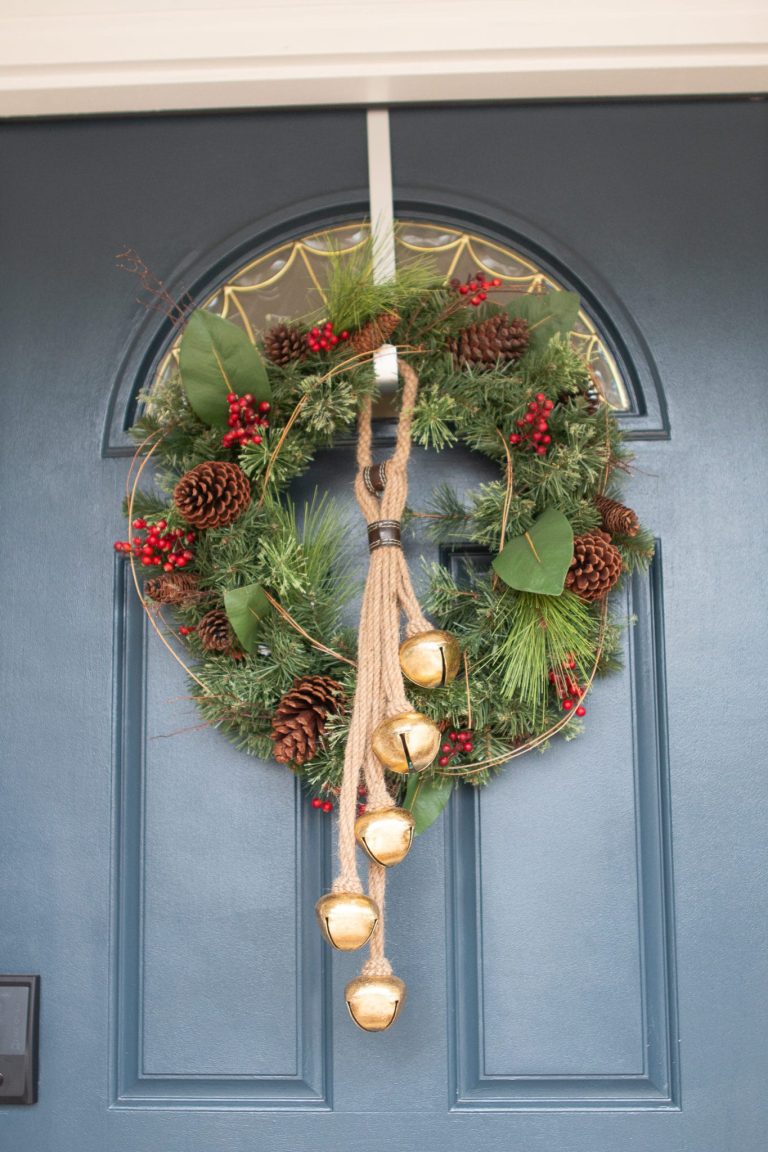 Front door with wreath and bells