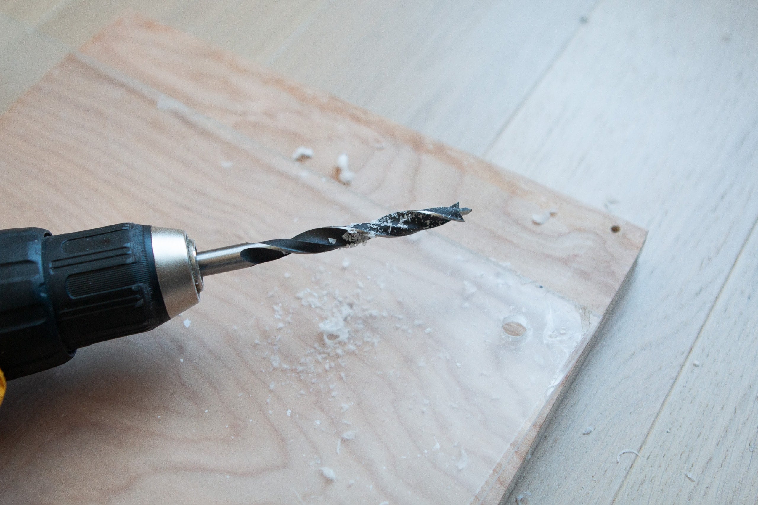 Use the right sized brad point drill bit set to create your holes for your DIY acrylic dry erase board