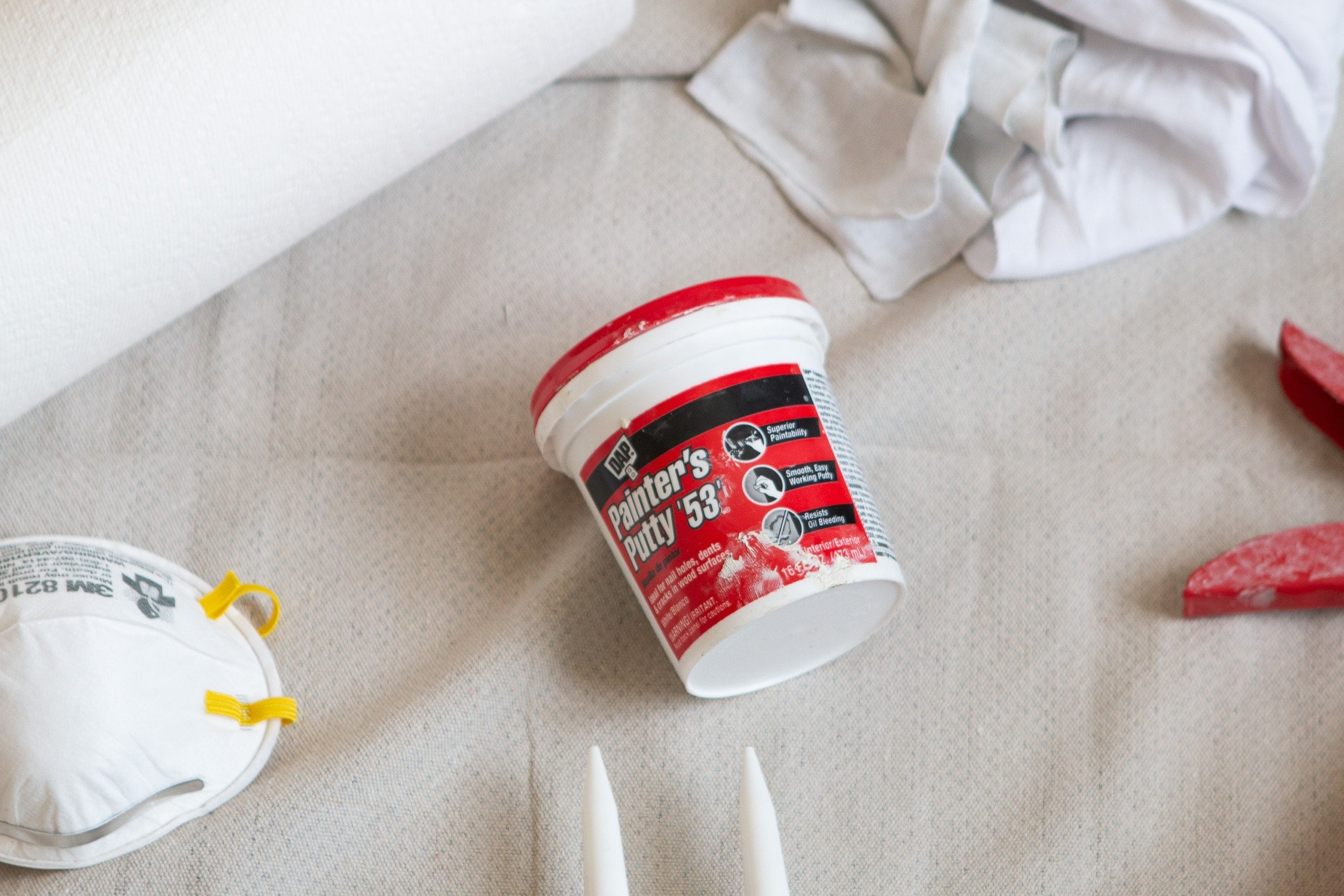 How to use painter's putty to fill nail holes