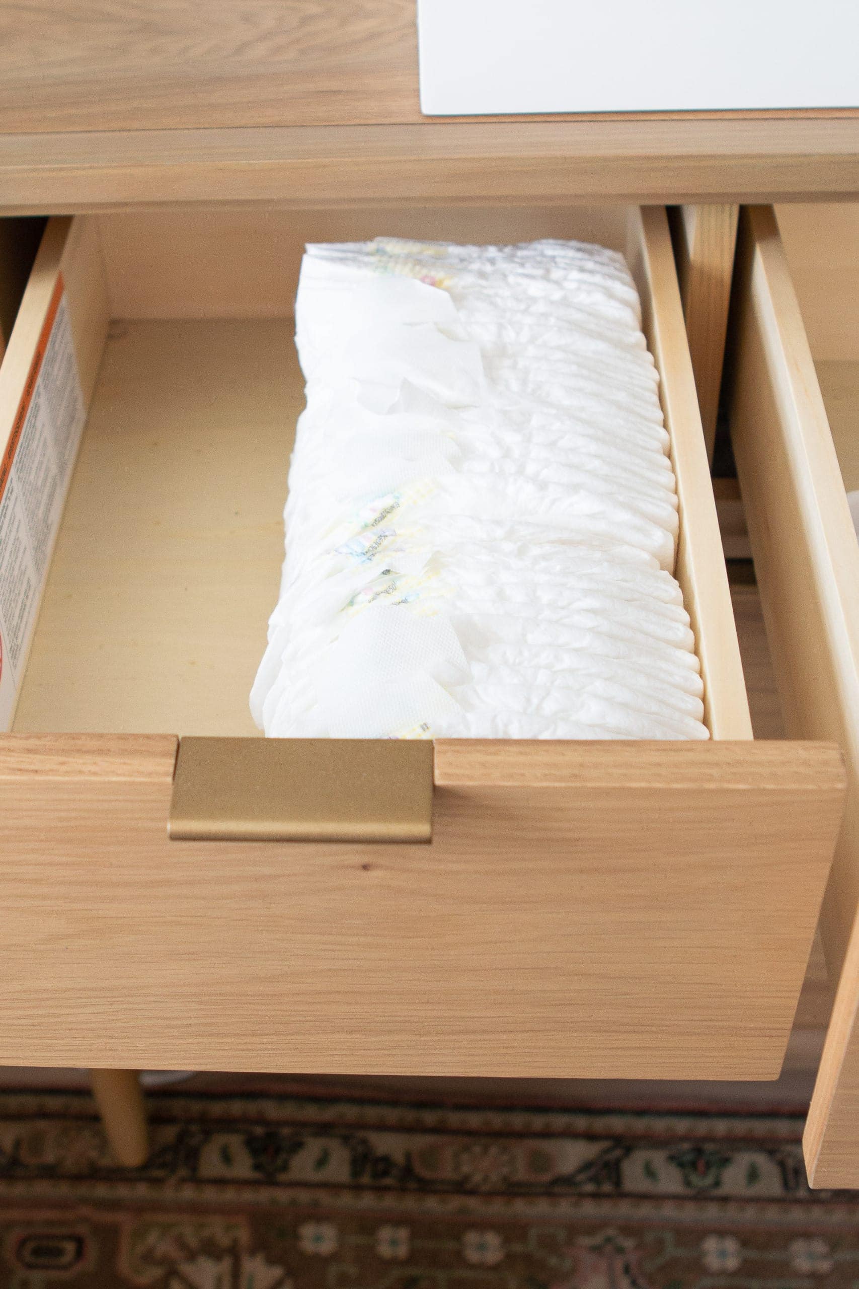 Diapers in the top drawers