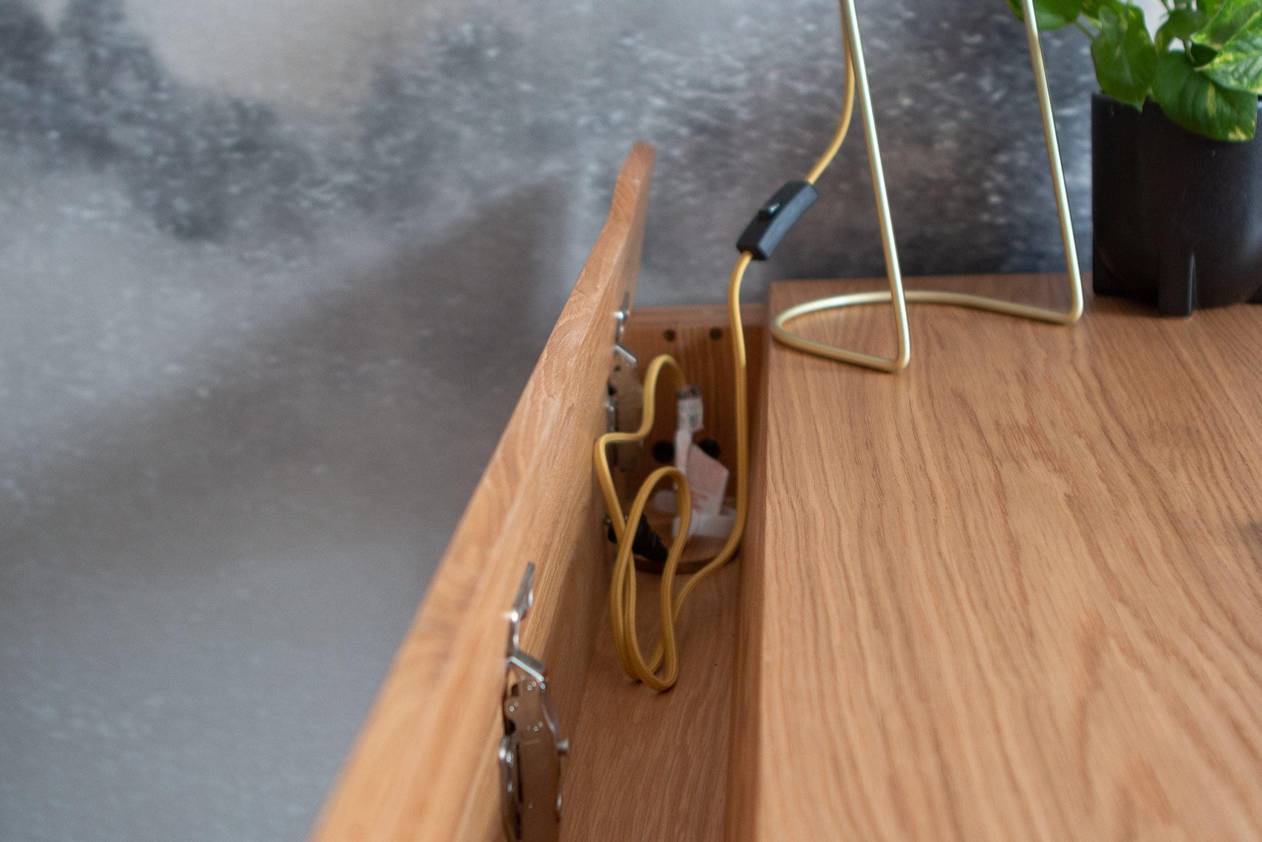 Hidden compartment for cords