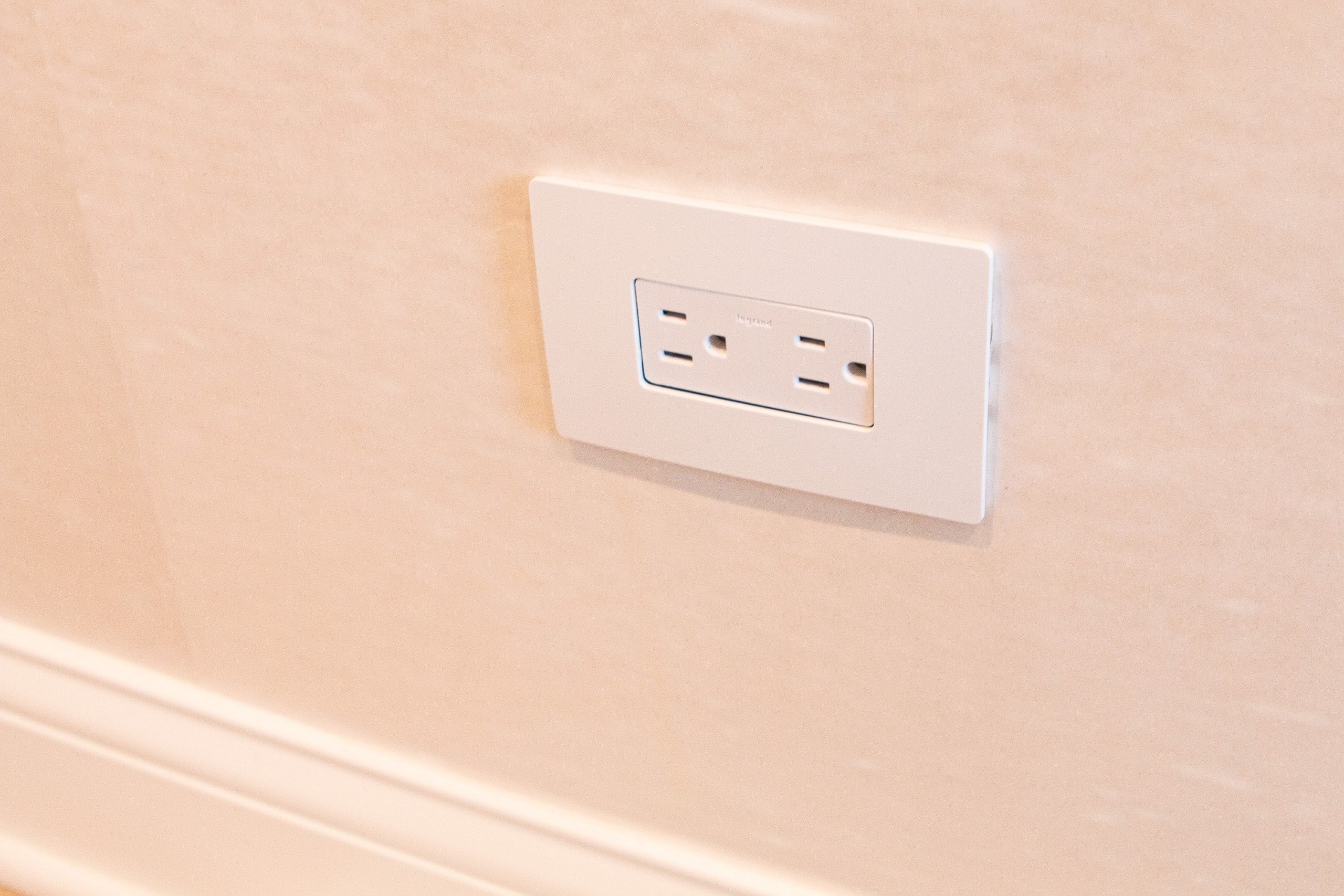 How to cut around an outlet when installing a wall mural 