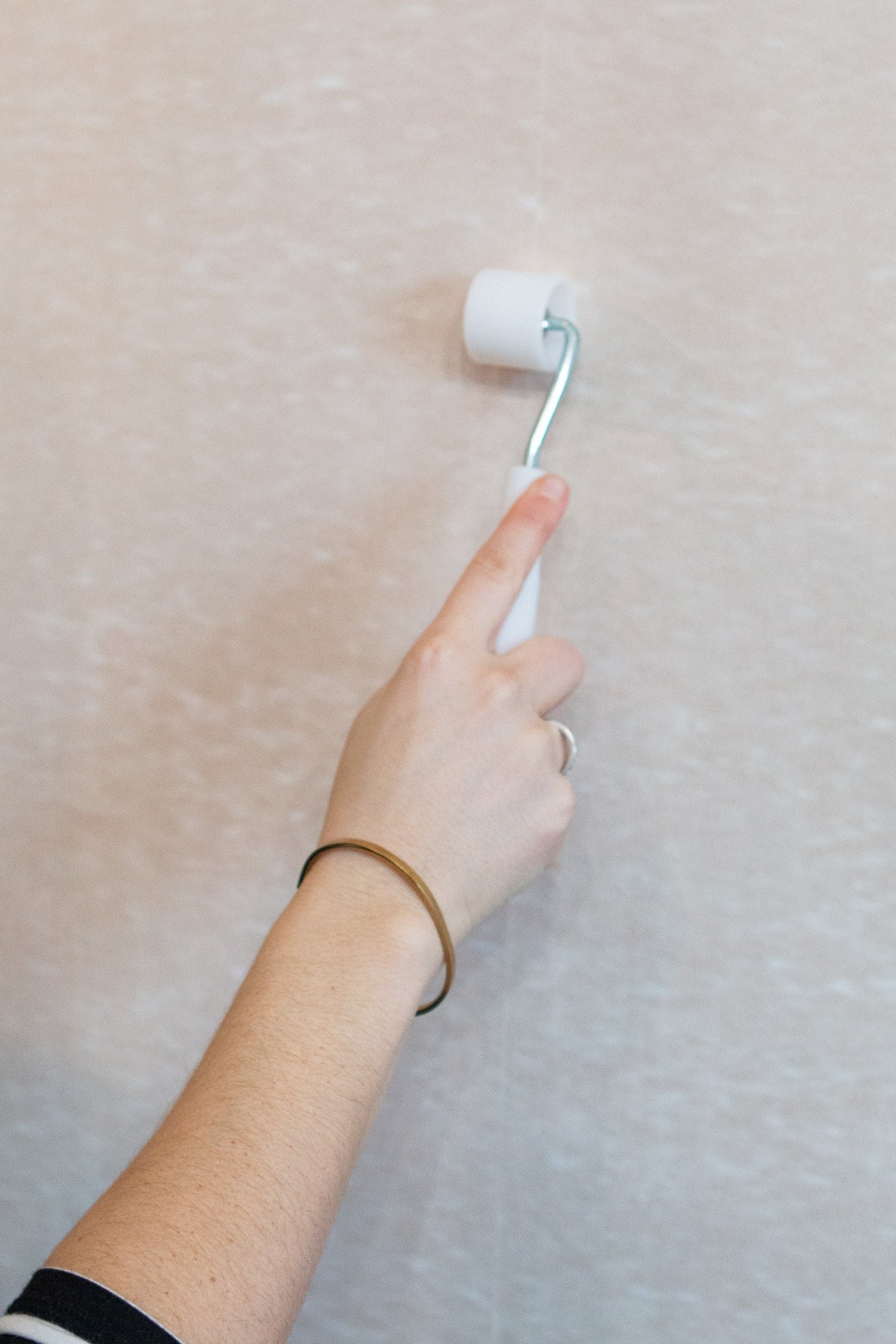Use a seam roller to smooth your wall mural