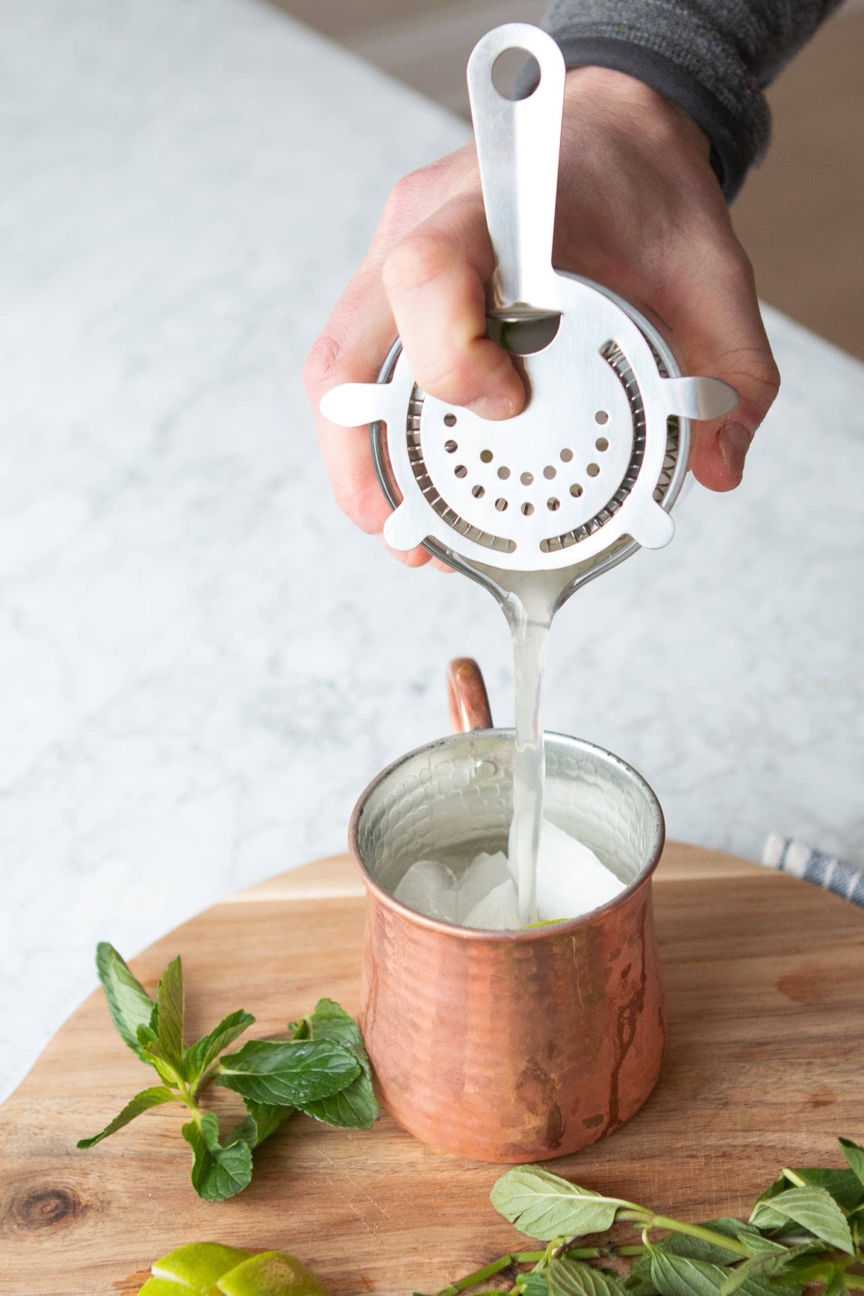 Strain into a copper mug