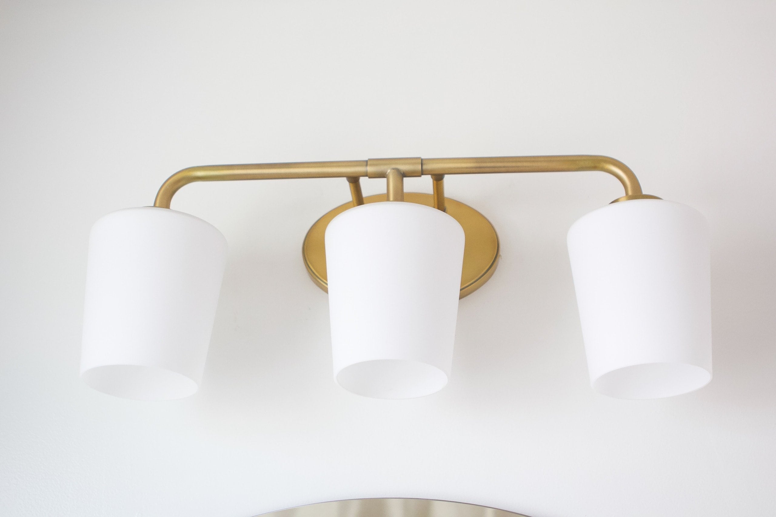 Brass vanity light fixture