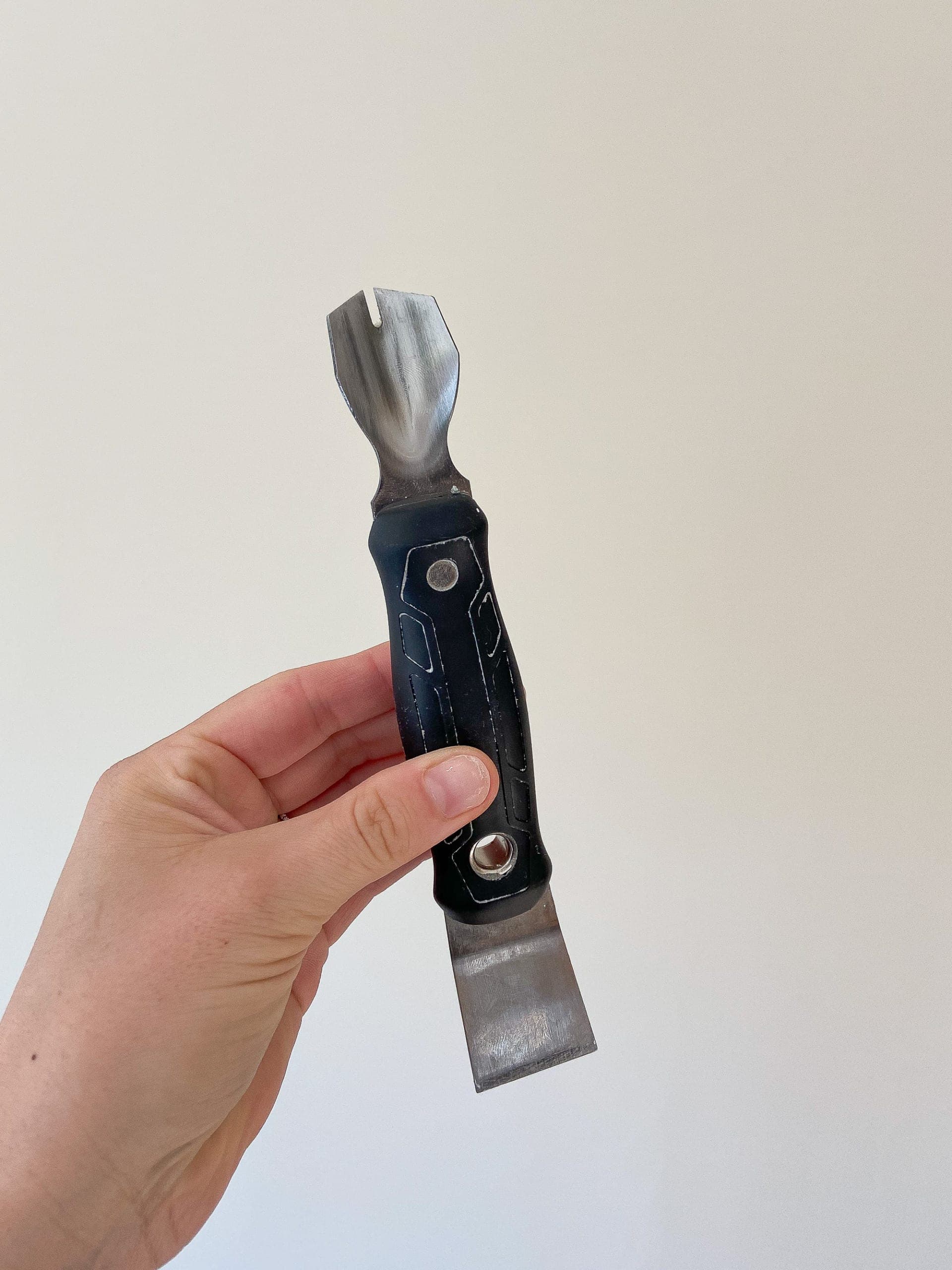 Use a caulk removal tool to scrape out the old caulk
