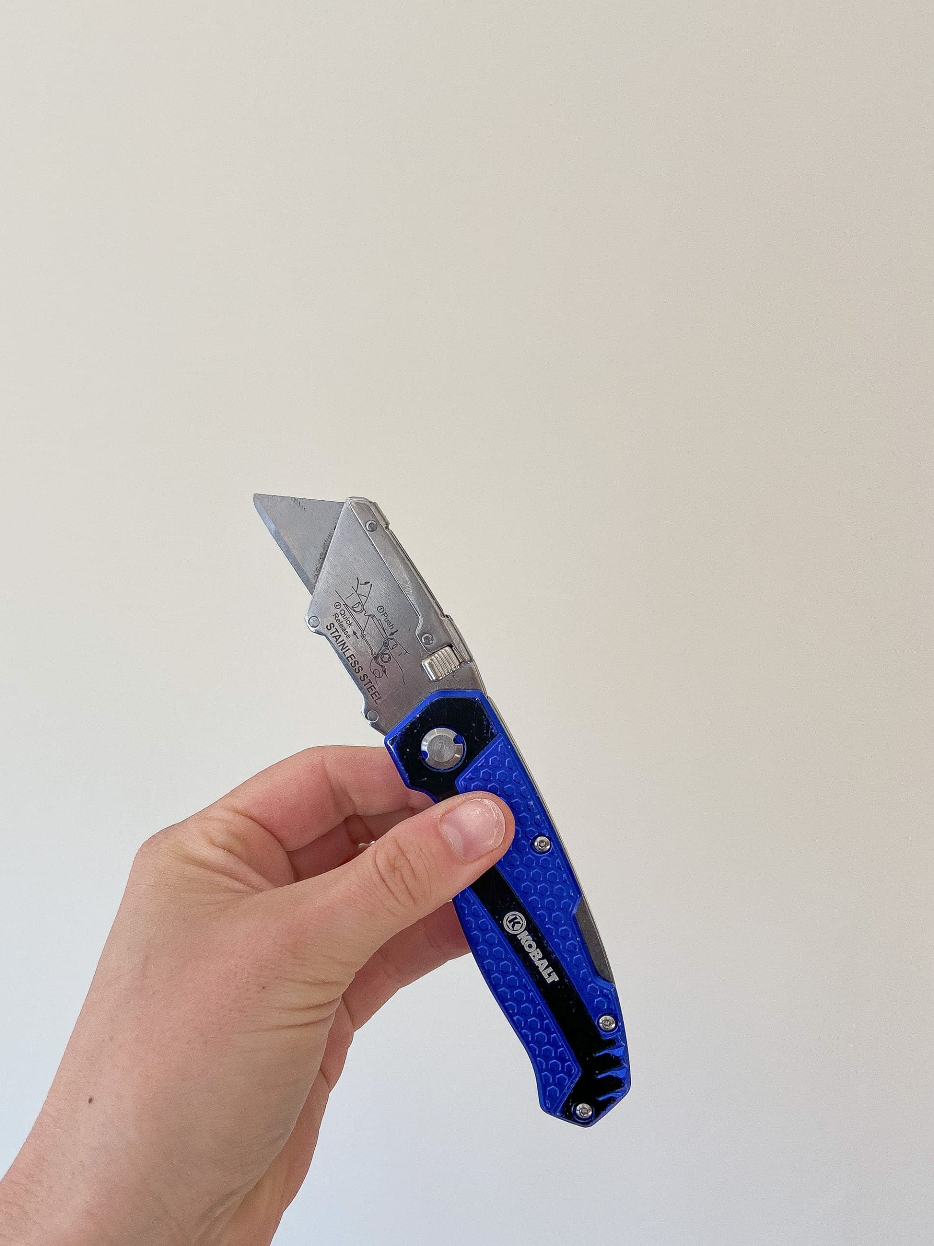 Use a razor to score the caulk