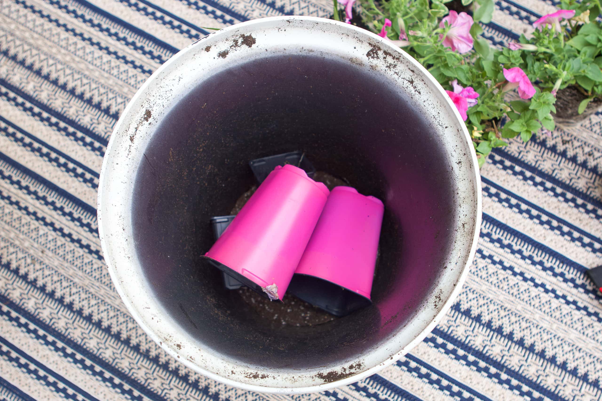 Put plastic containers in the bottom of thep ot. 