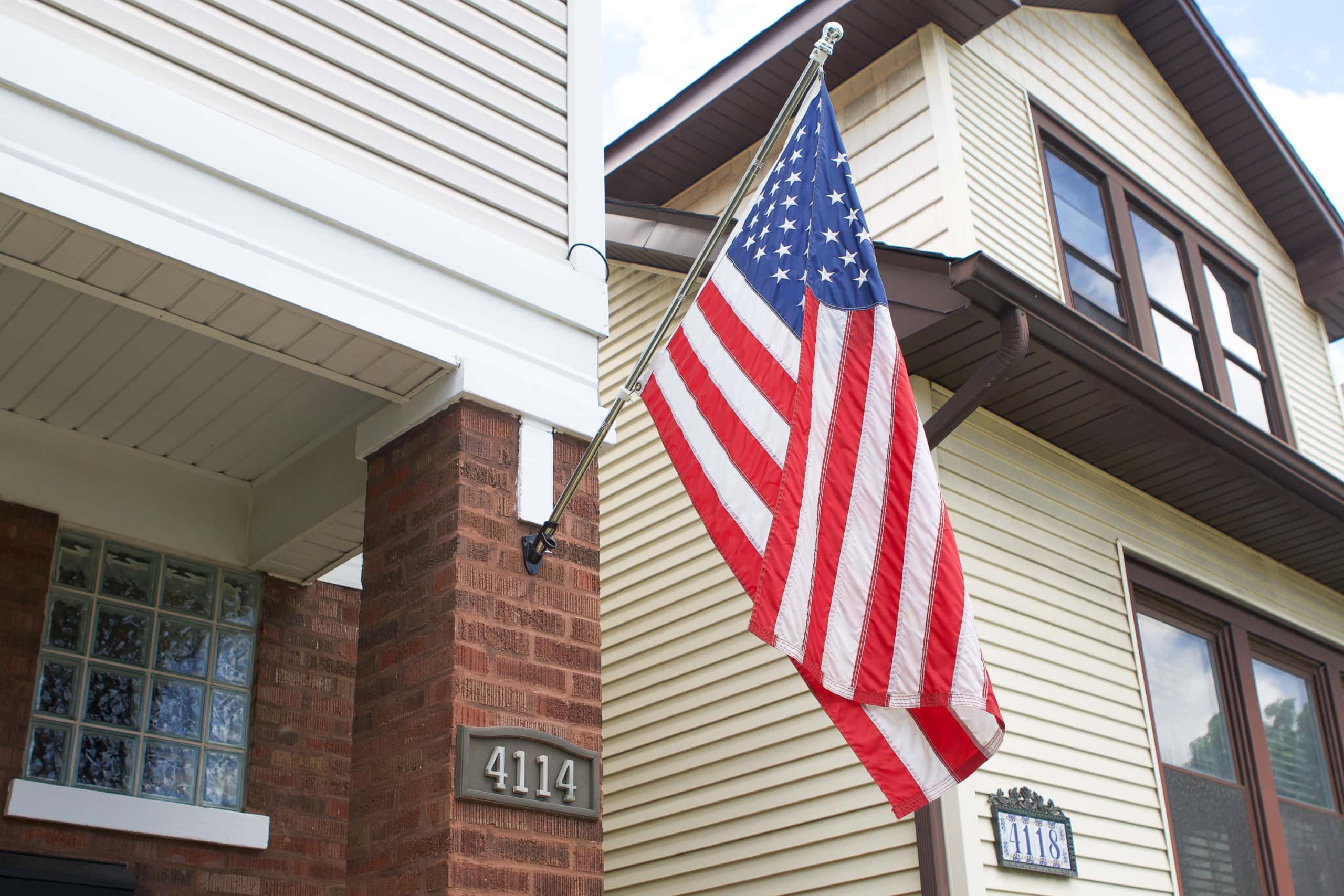 How to install a flag pole into brick