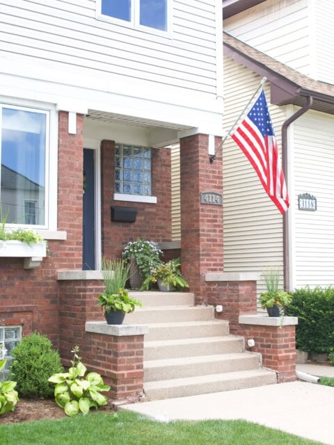 How to install a flag pole into brick