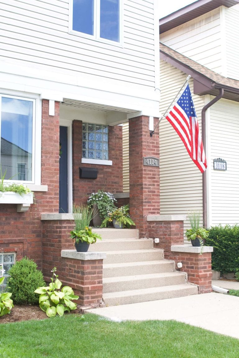 How to install a flag pole into brick