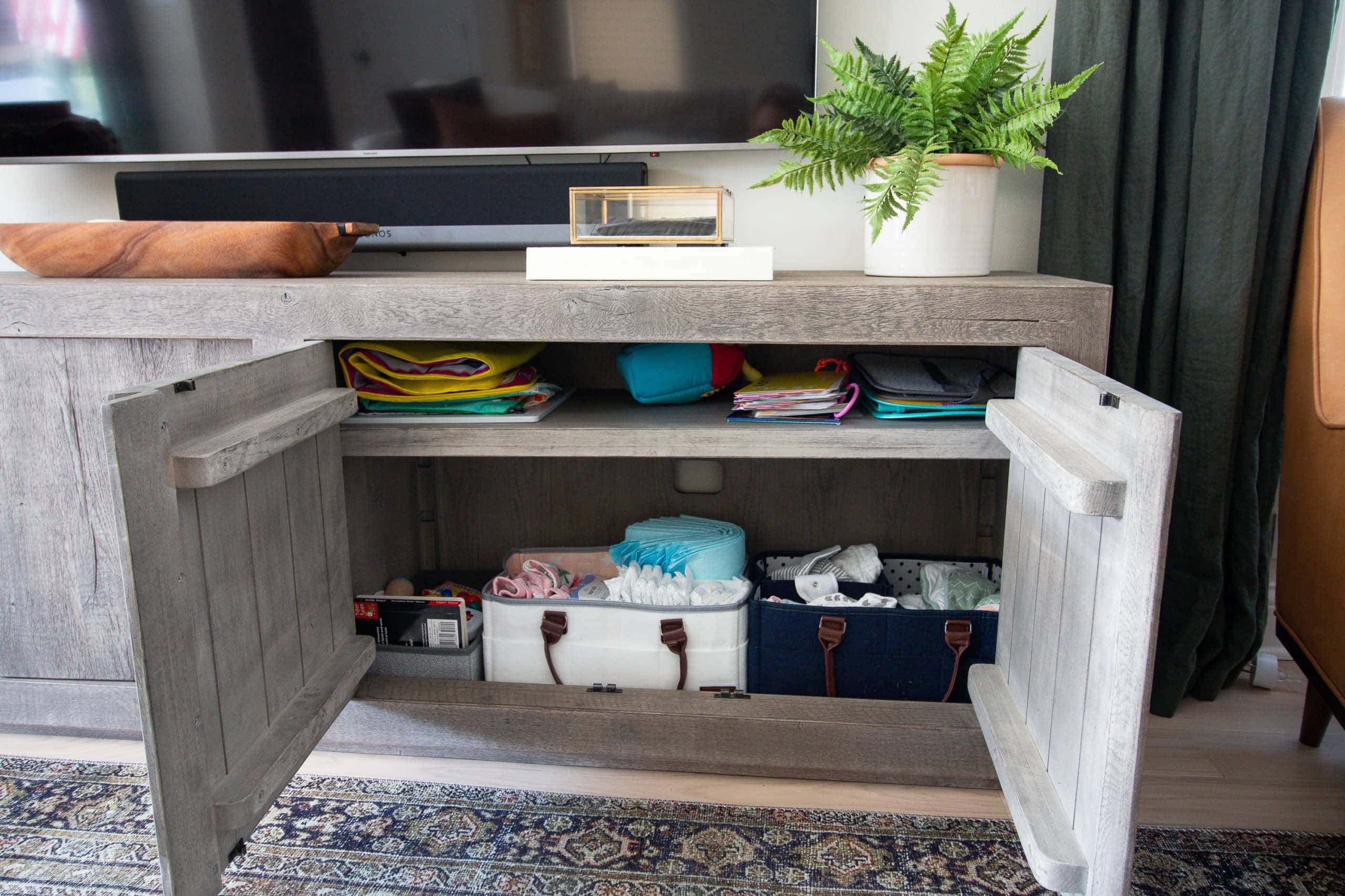 How we organize our baby supplies in our living room