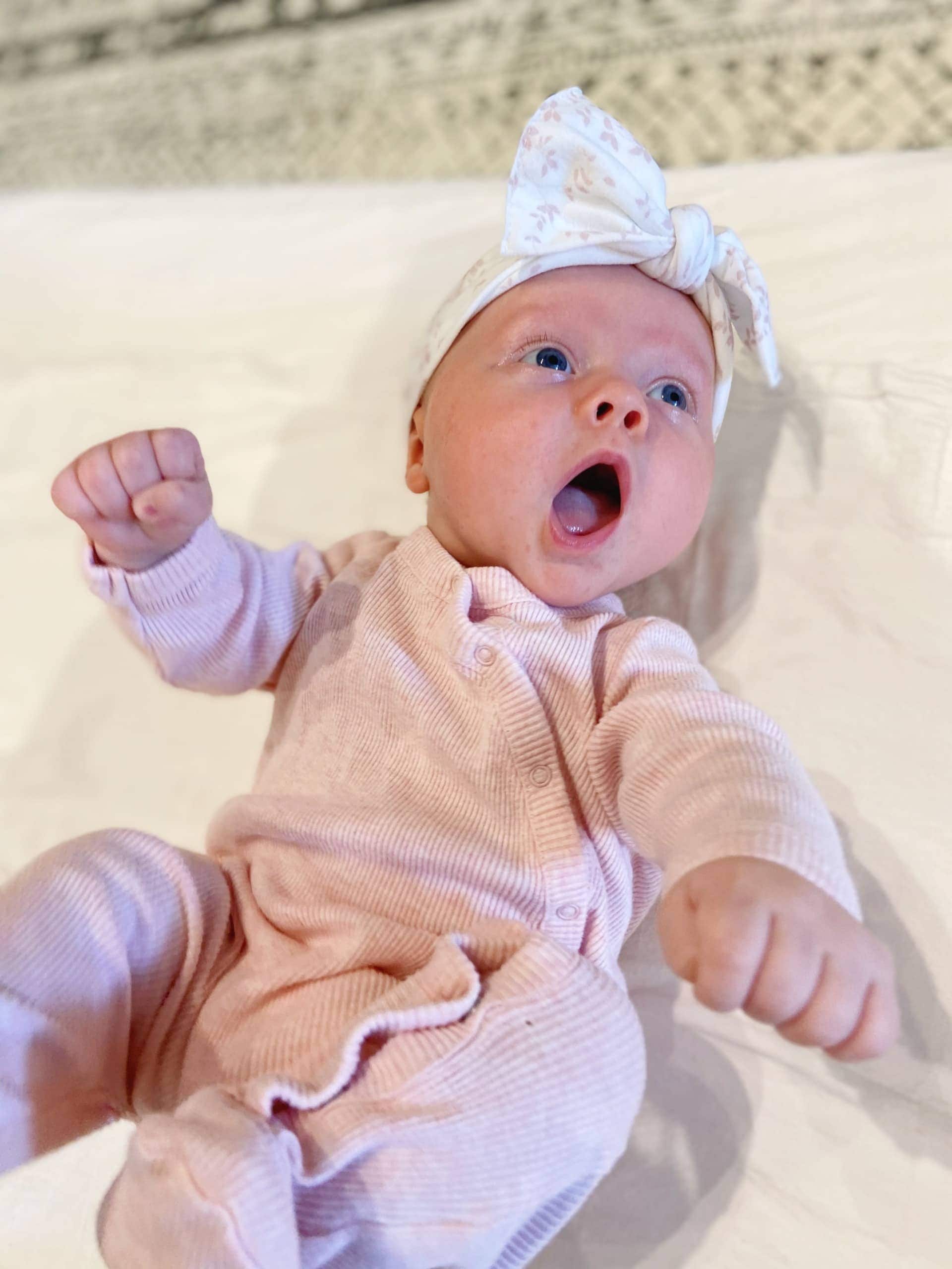 Rory wearing bow and pink onesie