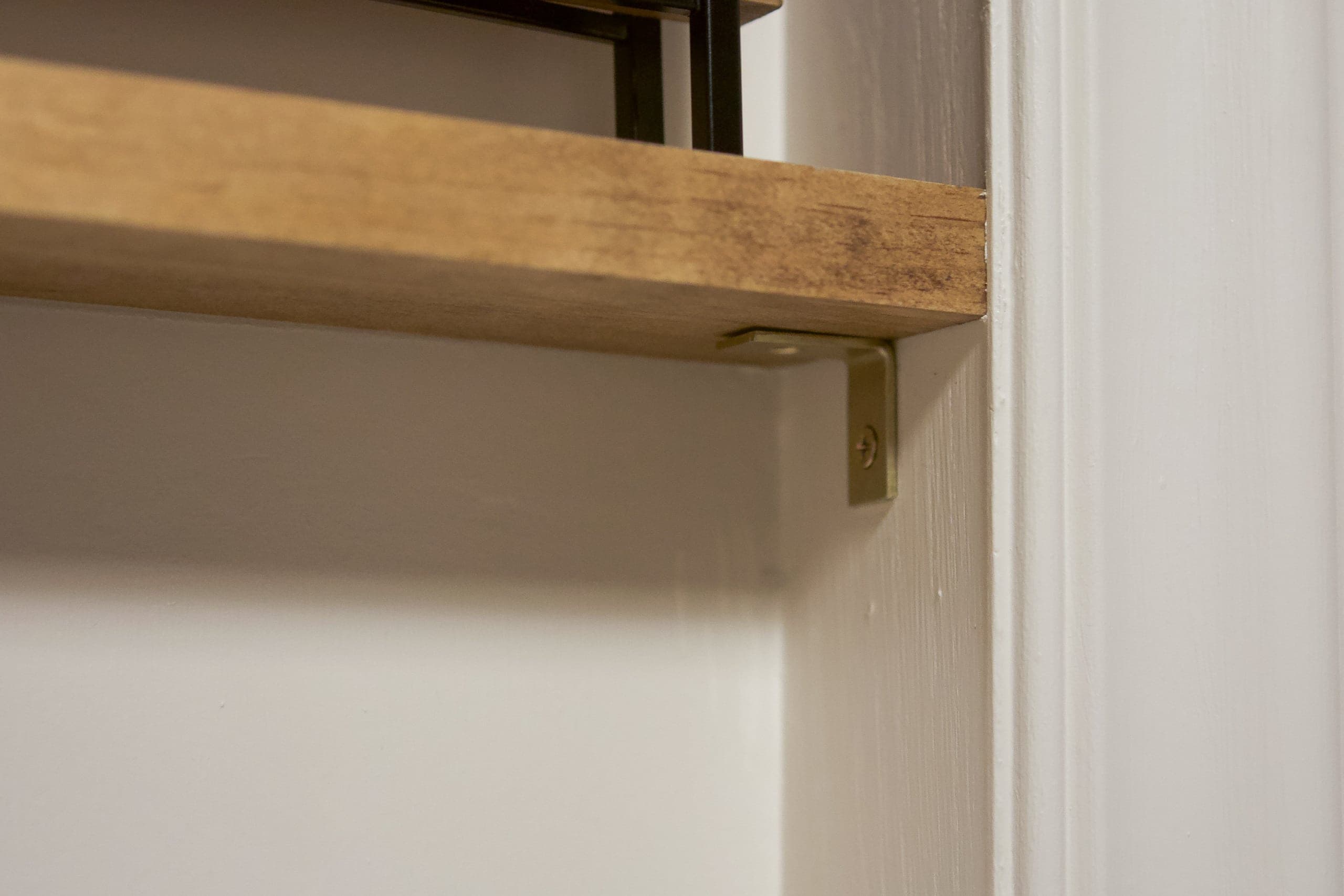 $3 gold brackets for our window shelves