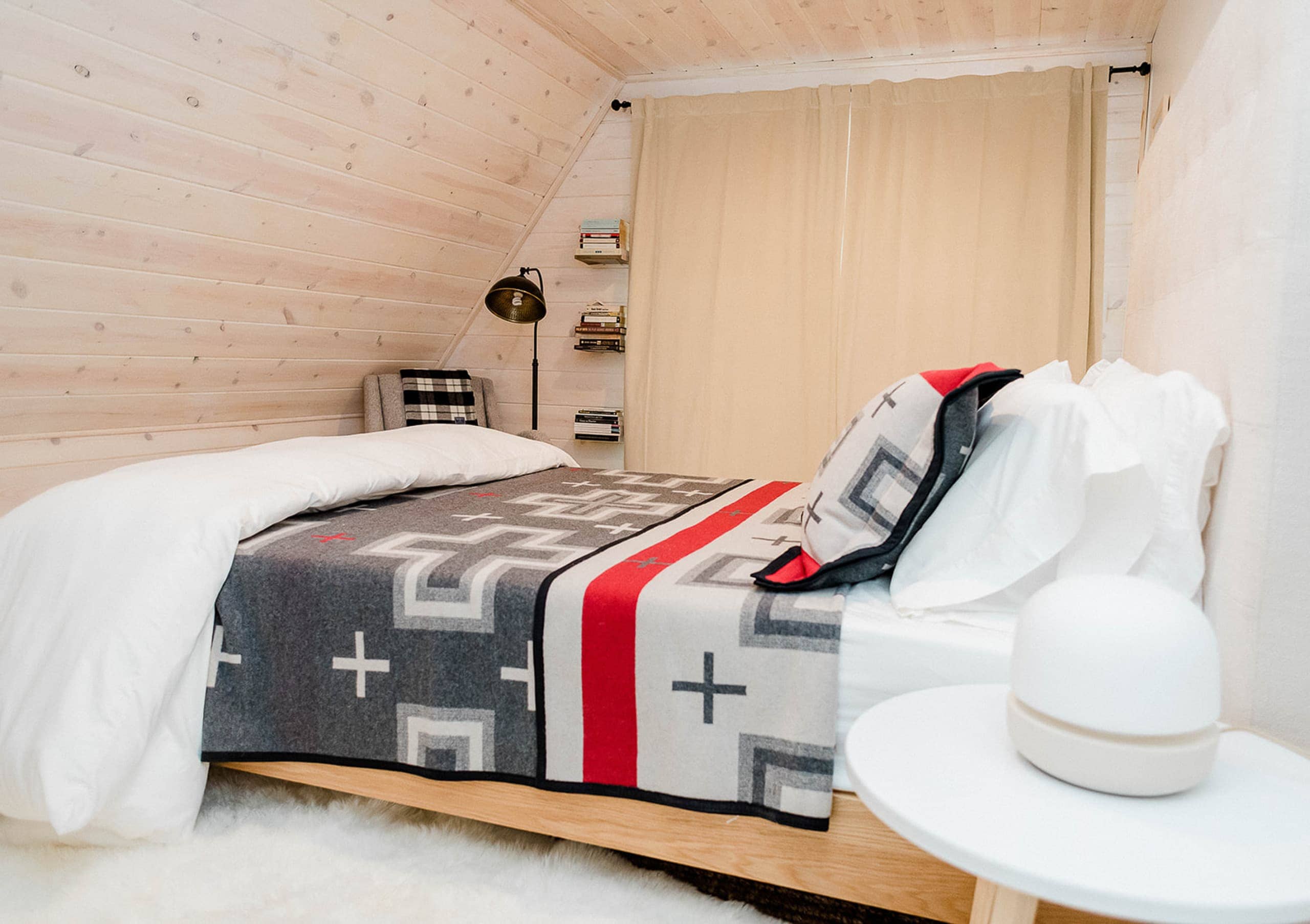 A southwestern style bed in an a-frame DIY cabin