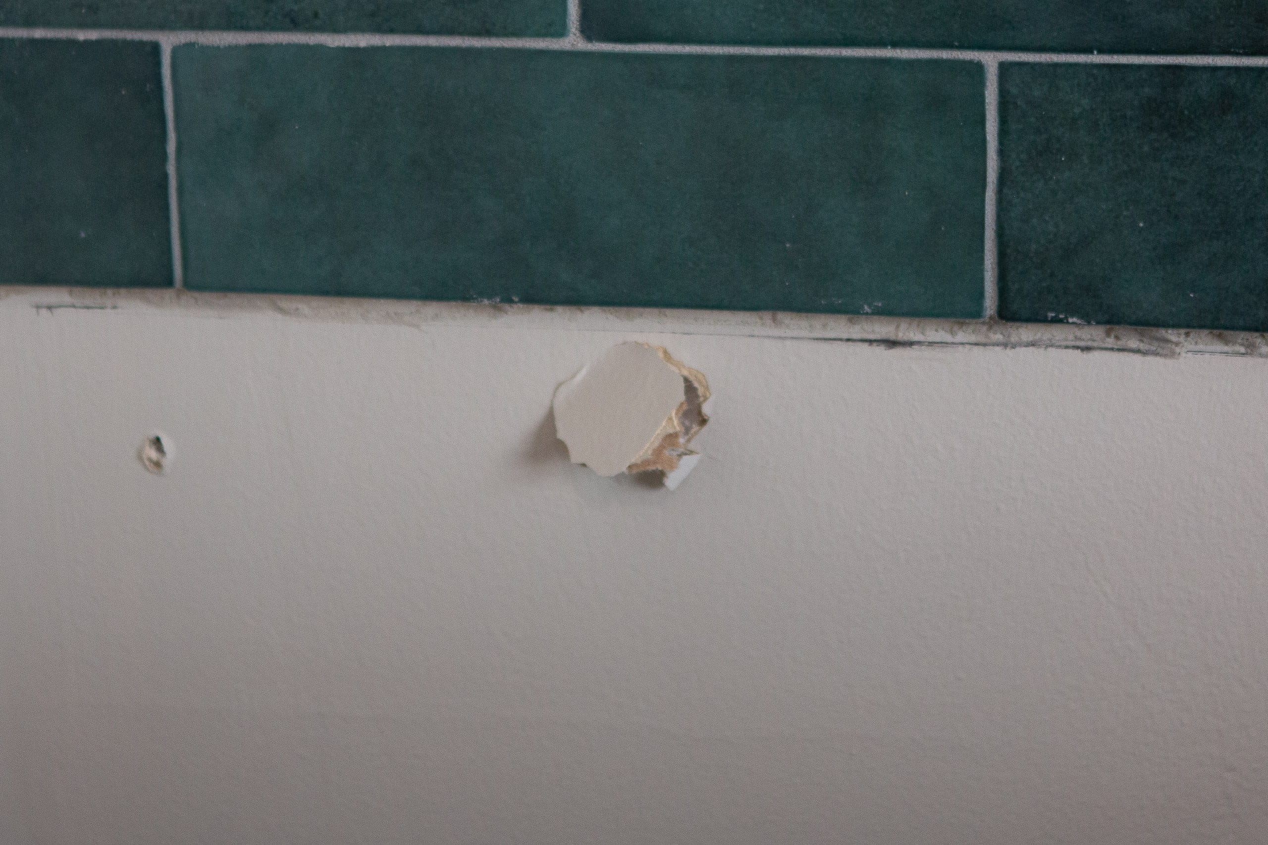 Making a hole in the dry wall to install the Frame TV