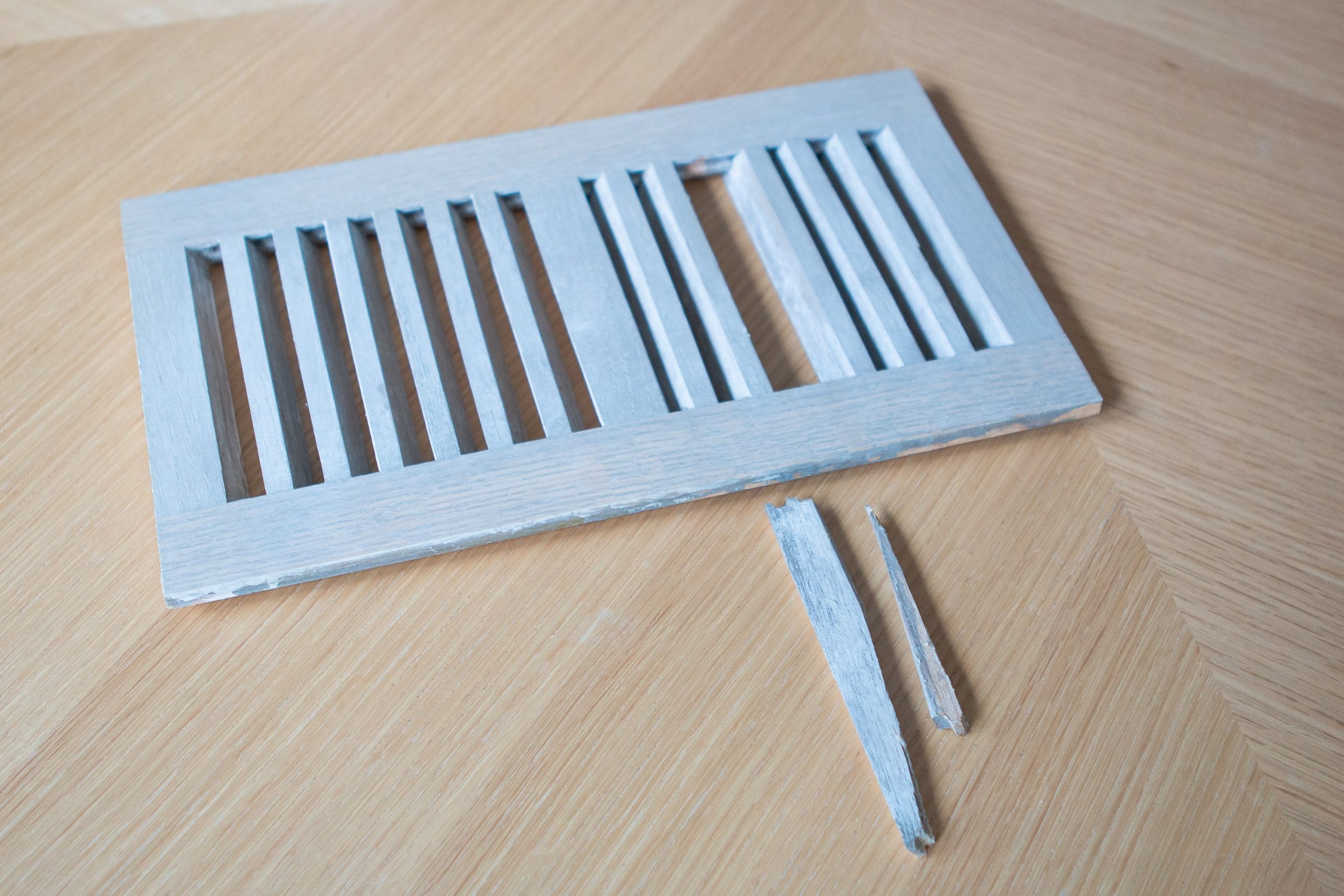 Using super glue to fix our wood floor register