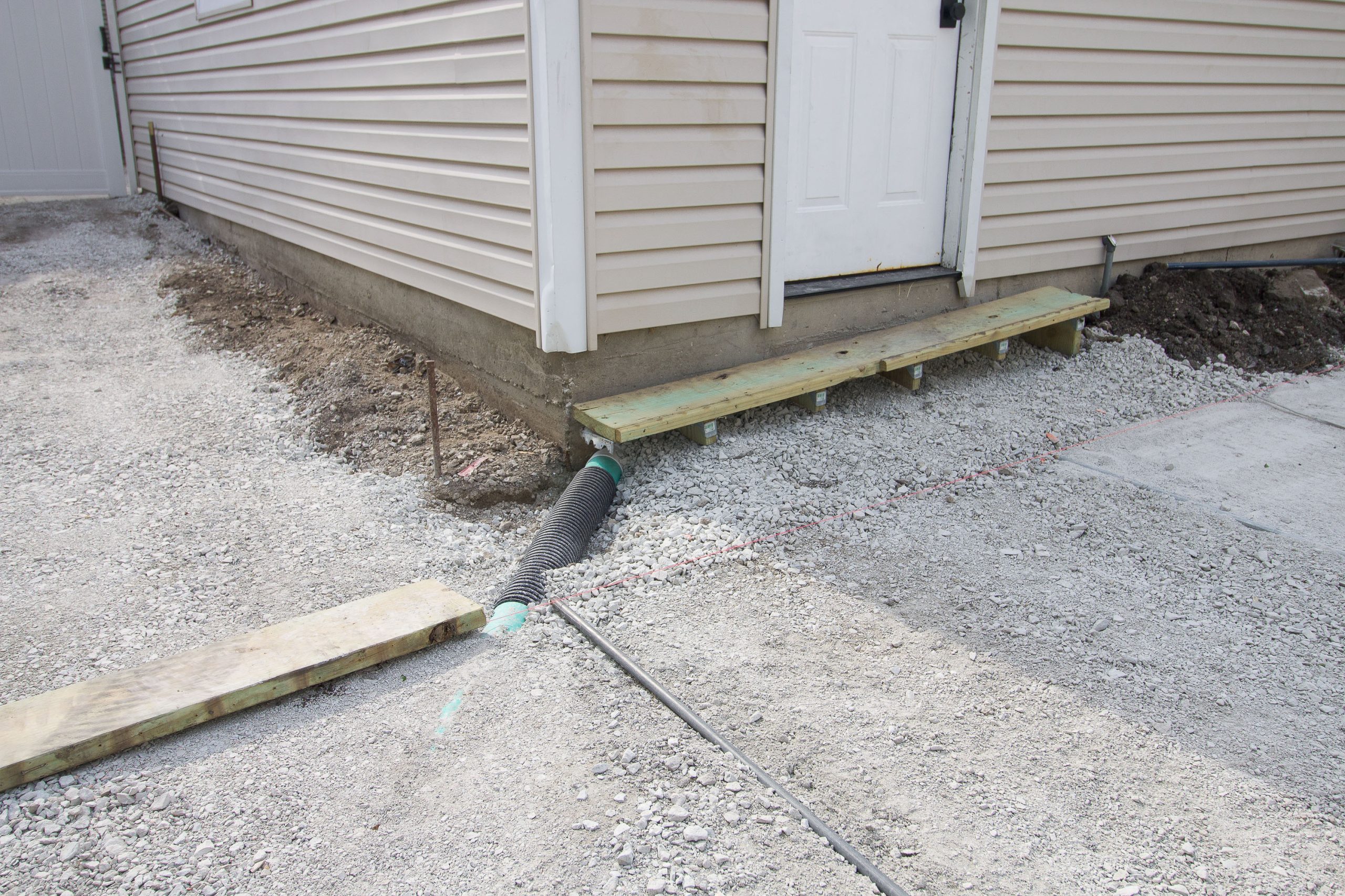 adding a drainage system in our backyard