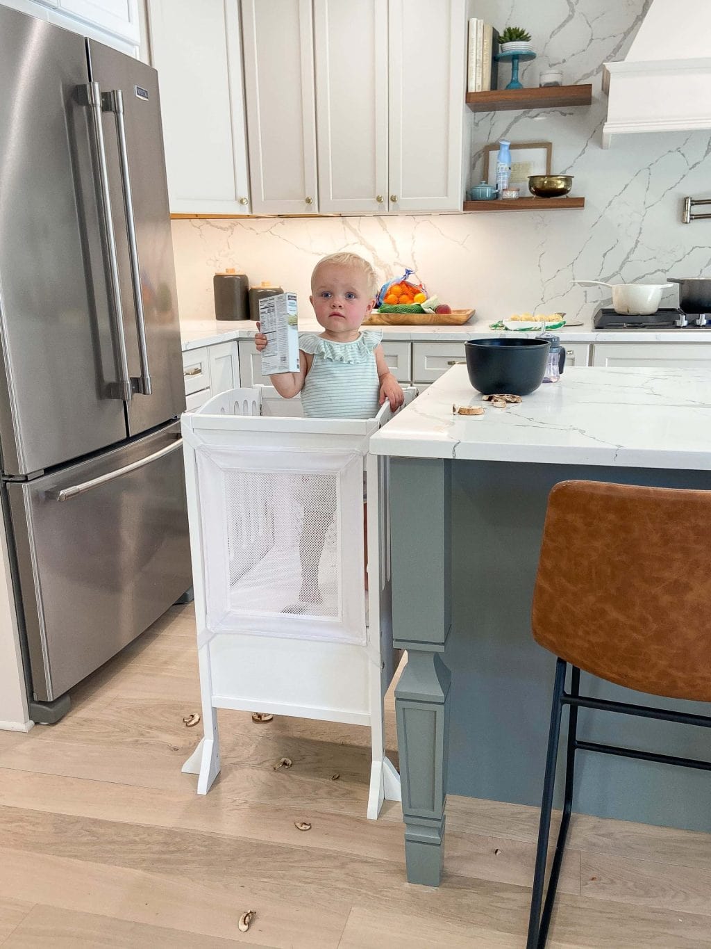 Rory using her learning tower in the kitchen