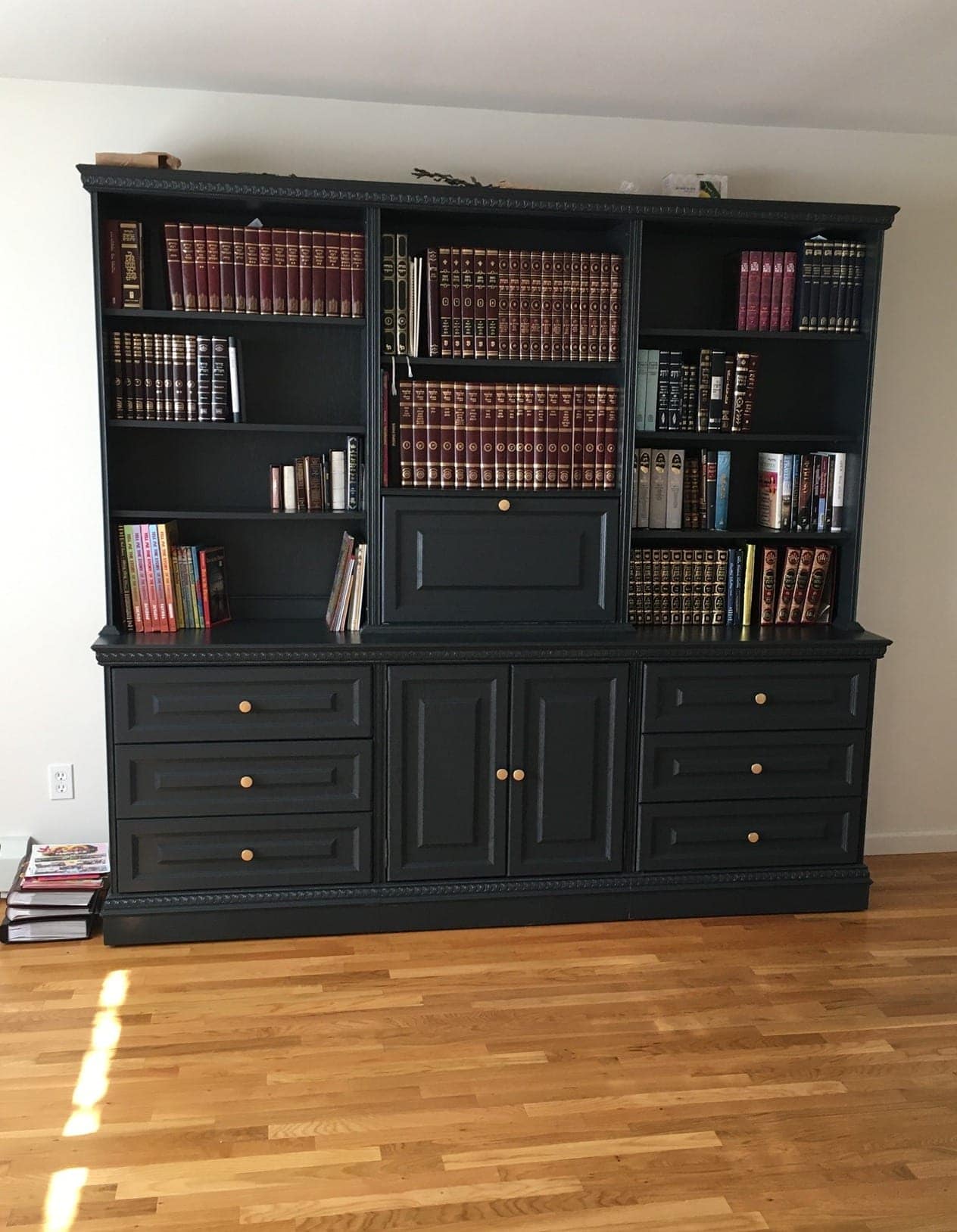 A bookcase painted black