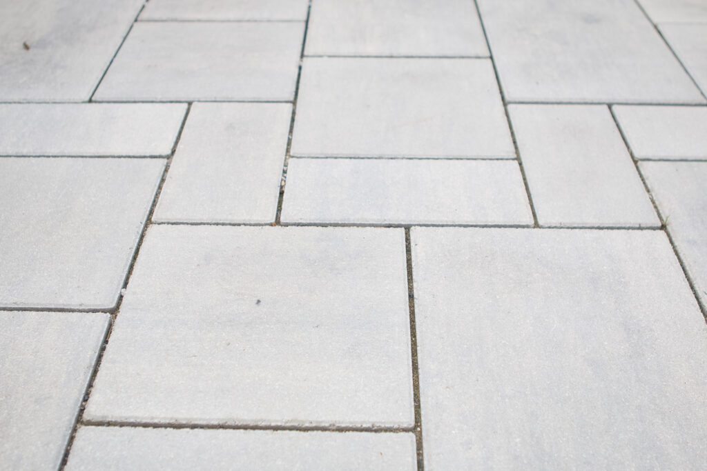 Adding material between our stone pavers