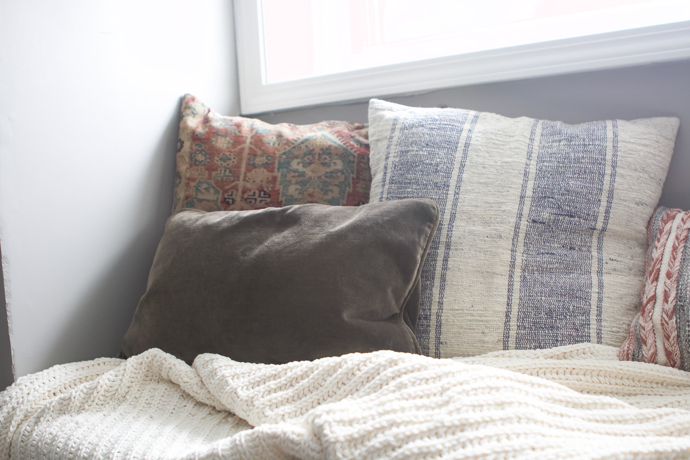Pillows in our basement reading nook